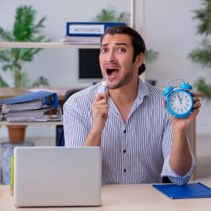 Hungry male employee waiting for food in time management concept Work-Life